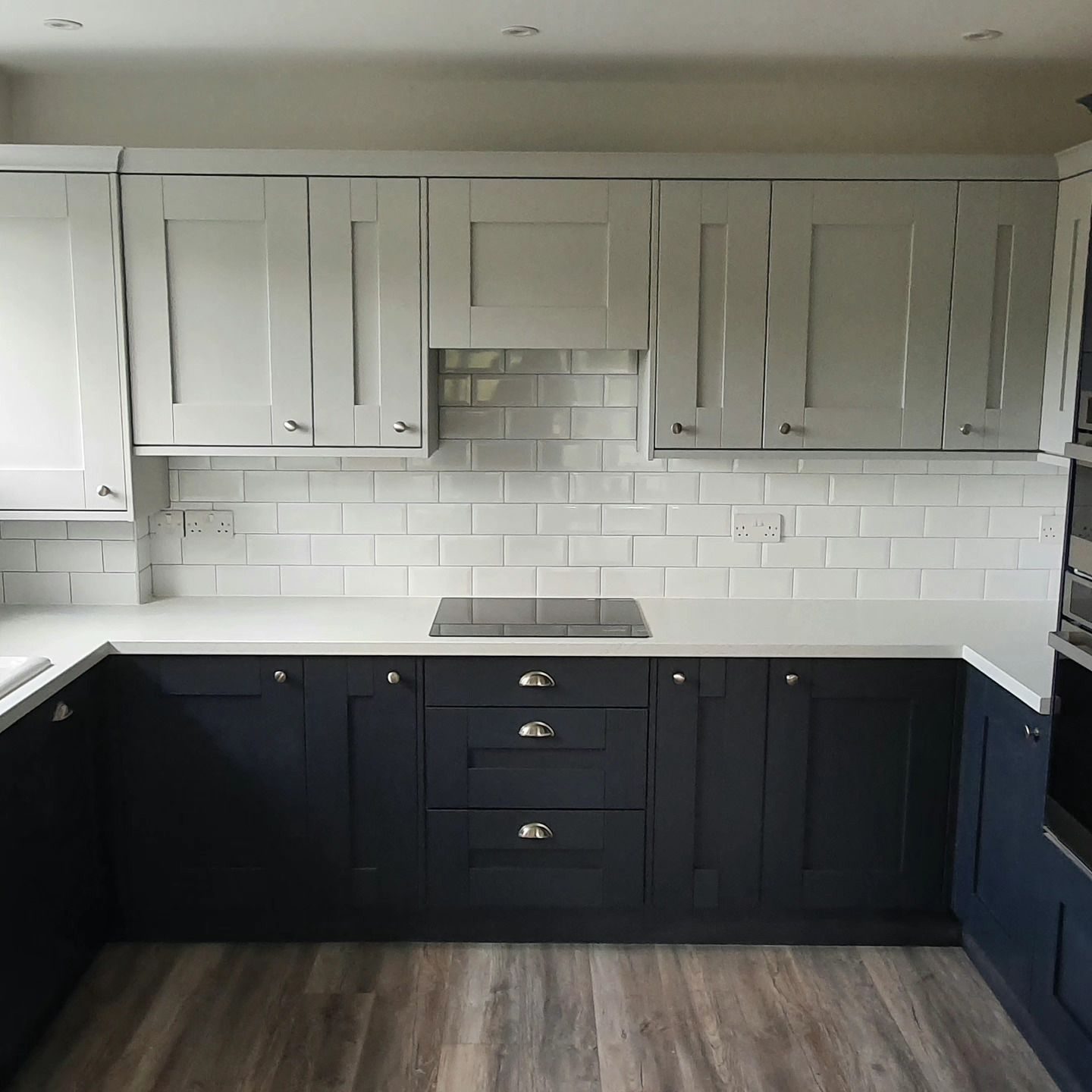 Navy and dove grey kitchen with metro tiling